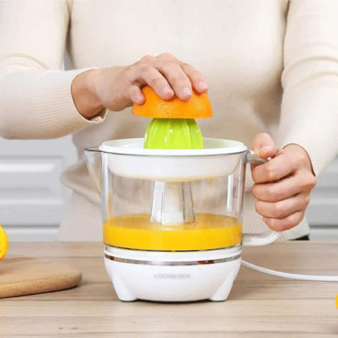 BXFirs Electric Masticating Juicer For Citrus Fruits Lemon Orange Grapefruit Press With Easy Clean Spout 45W Squeezer Machine in use.