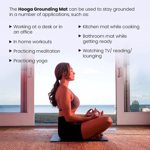 Woman meditating on a Grounding Mat For Wellness 24x16 Inch Conductive Carbon Pad with 15 Foot Cord, in a home setting, near a window.