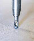 Self-centering drill bit, 1/4 in, metal, in chuck close-up