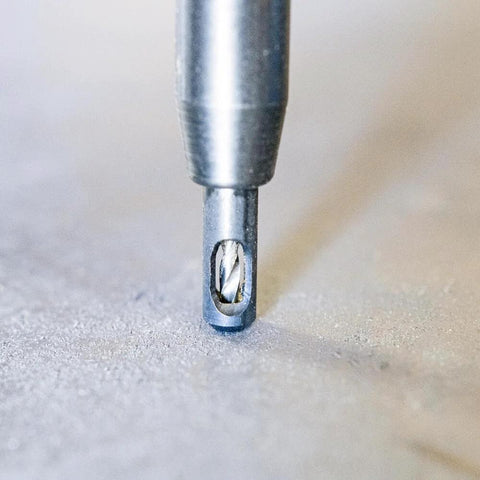 Self-centering drill bit, 1/4 in, metal, in chuck close-up