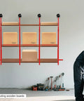 Side view of 4 Pack 52 By 19 Inch Red Industrial Shelf Brackets Beefy Heavy Duty Support for Storage Racks in a workshop.