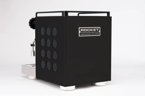 Side view of Appartamento 2.0 Espresso Machine With Heat Exchanger, 1.8L, black finish, featuring deep drip tray and valves.