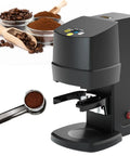 Automatic Electric 58mm Coffee Tamper Built For A No Sweat Daily Grind Featuring Rock Solid 10 To 30Kg Of Steady Pressure For Espresso Bean Powder Press And Matte Black Finish with coffee beans and ground coffee.