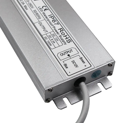 Close-up of IP67 waterproof LED driver 100W 12V DC 8.5A transformer with US 3-prong plug and slim durable design for outdoor use