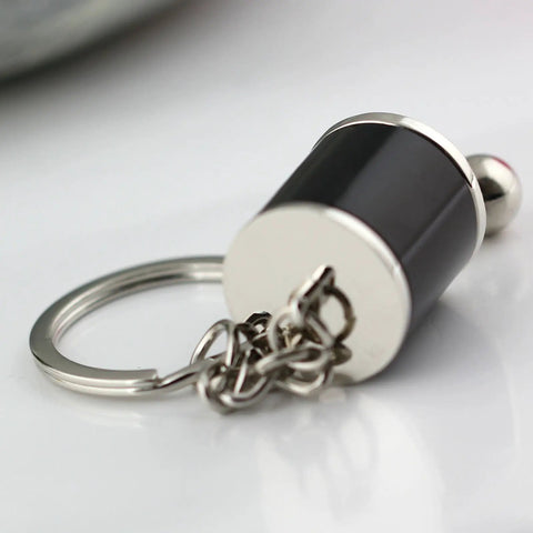 Killer 3D Manual Shifter Keychain With Moving Gear Lever And Hella Realistic Chrome Alloy Auto Part Key Ring Featuring Sweet Ride Design Plus Lit Gift For Gearheads And Car Enthusiasts in chrome and black with keyring.
