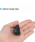 Mod 1 Pinion Gear 32 Teeth 6mm Bore Hardened Steel for RC Cars Trucks and Buggy held in hand showing 34mm outer diameter
