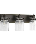 Calhoun Collection Clear Glass Farmhouse Bath Vanity Light Three Light Antique Bronze Finish With Thick Glass Shades