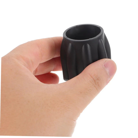 Hand holding Scuba Tank Valve Replacement Part For Tight Seal And Top Notch Safety, compact cylinder valve accessory in black.