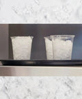 Countertop Nugget Ice Maker With Dispenser Churning Out Chewable Flake Ice On The Fly With Up To Three Hundred Fifty Pounds Daily Production Featuring Hassle Free Cleaning Panels For Your Bar Or Kitchen, showing cups filled with chewable ice.