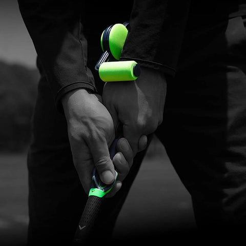 Golf Swing Trainer Wrist Aid For Instant Feel And Form attached to a club for real-time feedback on wrist position and grip