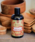 Straight Up Coconut Mct Wood Finishing Oil And Food Safe Cutting Board Sealer Restores Grain Naturally Every Time Rub In Wipe Off With Zero Hassle Care For Natural Wooden Surfaces Real Deal Quality In An 8 Oz Bottle You Need placed next to wooden bowls.