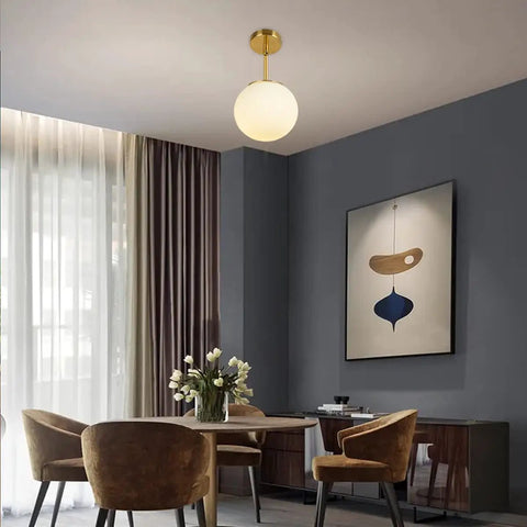 Dining room with Dope Globe Pendant Light With Matte White Glass And Brass Finish One Light Mid Century Modern Ceiling Fixture