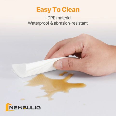 Hand wiping spill on 4 Ft Folding Picnic Table Portable And Lightweight For Camping Picnics Beach Days Tailgating Dining And Parties Indoor Outdoor Use With Carrying Handle And Easy Fold For Quick Storage In Car Trunk Or Closet, HDPE top.