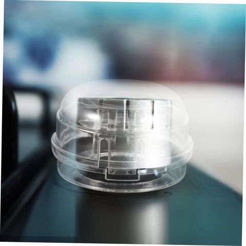 Close-up of Six Pack Stove Knob Covers Transparent Safety Guards For Gas Electric And Induction Stoves And Washing Machines Easy To Install Button Protectors For Kid Safe Home No Fuss Family on a stove.
