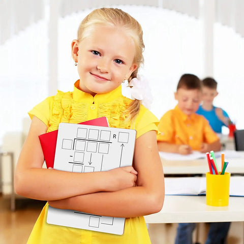 Child holding Two Pack Dry Erase Math Boards For Multiplication And Division With Charts, Kid Friendly Whiteboards, Classroom Setting