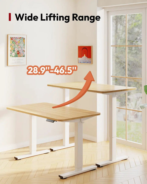 Electric Height Adjustable Standing Desk 40x24 Inches Sit Stand Desk With Splice Board For Home Office Setup Ergonomic Computer Workstation For Study And Gaming White Frame Maple Top in height adjustment mode in a modern room.