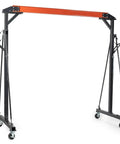 Bad Boy Heavy Weight One Ton Gantry Crane Frame Rated For Two Thousand Pounds adjustable portable shop hoist rig with black and orange design