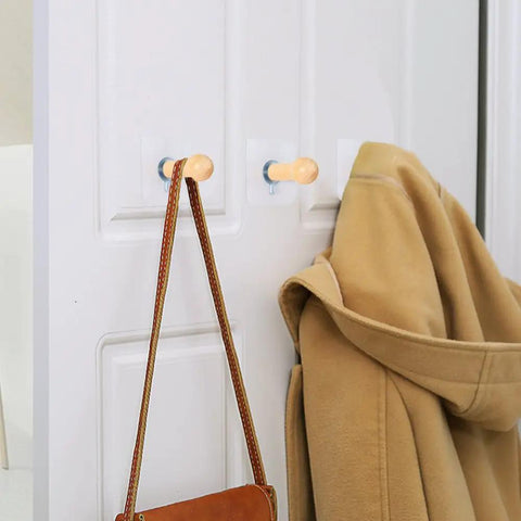 Must Have Adhesive Hat Hooks And Hangers Wall Rack Up To Eight Pounds For Baseball Caps Cowboy Hats Bucket Hats And More Eight Pack Entryway Wardrobe Organizer With Handmade Extended Wooden Pegs holding a coat and bag
