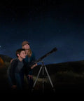 Children stargazing with PowerSeeker 60AZ Telescope For Beginners With Manual Alt Azimuth Mount Compact Portable Refractor at campsite.