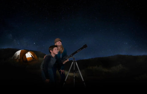 Children stargazing with PowerSeeker 60AZ Telescope For Beginners With Manual Alt Azimuth Mount Compact Portable Refractor at campsite.