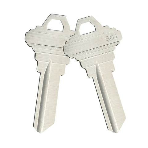SC1 5 Pin Key Blanks Pack Of 50 Brass Silver Blank Keys For Schlage C Keyway Locksmiths And Home Key Replacement Projects Great For Spare Keys And DIY Key Cuts close-up of two silver brass keys