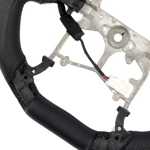 Close-up of Toyota Tacoma 2016 2023 Heated Perforated Leather Steering Wheel Replacement Kit, Premium Microfiber Leather