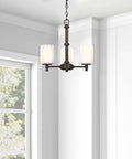 Three Light Ceiling Chandelier With Opal Clear Glass Shade For Dining Room Living Room Hallway And Kitchen Island In Oil Rubbed Bronze Finish Modern Cool Home Lighting And Decor in a bright room.