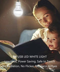 Two Pack USB LED Camping Light Bulbs With 8.2 Ft Extra Cord Tent Lantern Handy USB Y Cable Powered Work Light illuminating a book