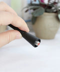 Close-up of 10 Pack UHF Whip Antenna 6.5 Inch Replacement For VX Series Radios showing connector end held in hand