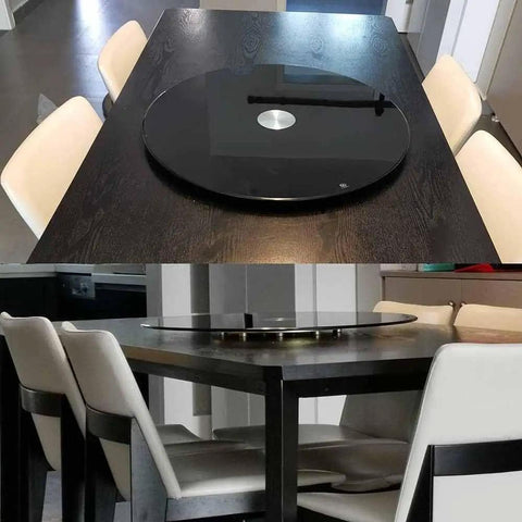 Heavy Duty Black Tempered Glass Lazy Susan Serving Turntable Featuring Smooth As Butter Spin For Effortless Food Sharing And Serious Kitchen Game Changer Vibes In A Generous 31 Inch Format on a dining table with white chairs.