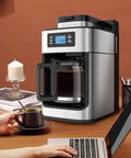 Top Tier Electric Coffee Machine And Automatic Milk Frother For Hella Smooth Cappuccinos with removable water tank on kitchen counter.