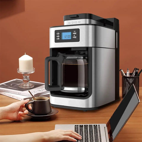 Top Tier Electric Coffee Machine And Automatic Milk Frother For Hella Smooth Cappuccinos with removable water tank on kitchen counter.