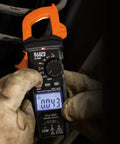 Electrician using Digital Clamp Meter With Auto Ranging TRMS, Measures AC DC Voltage And Current, LoZ Ghost Voltage