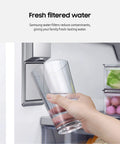 Hand filling glass with fresh water from fridge using Genuine Refrigerator Water Filter Pack Of 3 Carbon Block Filters HAF-QIN-3P.