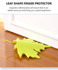 4 Piece Leaf Shape Door Stopper Finger Protector Set Made From Durable PP Material on wooden floor near white door.