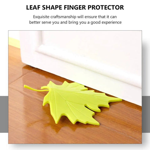 4 Piece Leaf Shape Door Stopper Finger Protector Set Made From Durable PP Material on wooden floor near white door.