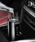 Leak Proof Electric Heated Travel Coffee Mug With Temp Control Fits Car Cup Holder Stainless Steel Insulated Thermos steaming with water pouring in.