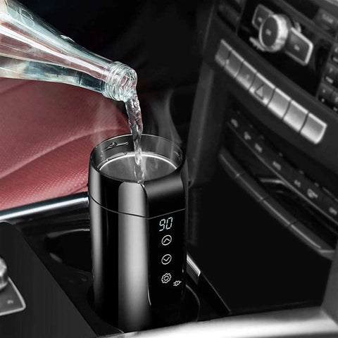 Leak Proof Electric Heated Travel Coffee Mug With Temp Control Fits Car Cup Holder Stainless Steel Insulated Thermos steaming with water pouring in.
