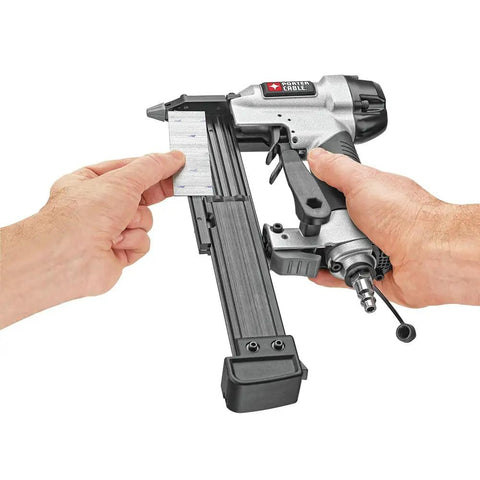Dead Simple Six Gallon Pancake Air Compressor Bundled With Three Pro Nail Guns including Finish Nailer in use with nails.