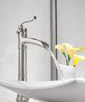 Vessel Sink Faucet With Waterfall Style In Brushed Nickel, Tall Farmhouse Style Bathroom Faucet flowing into a white sink