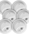 Classy Hardwired Smoke Detectors Boasting Bulletproof Battery Backup For Round the Clock House Protection, Superb Heat Triggers, And Snappy Response Times To Keep Your Crib Secure, 6 Pack Packaged For Whole Home Coverage And Serious Peace of Mind - six white smoke alarms displayed in a circular arrangement.