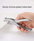 Hand using One Hole Punch For Office And Home Use, Five Sheet Capacity, Compact Metal Paper Punch in silver, chrome-plated steel