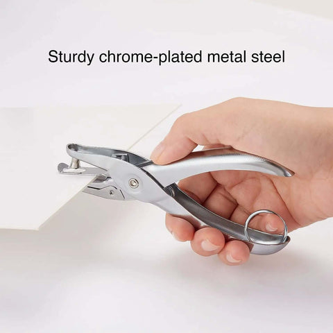 Hand using One Hole Punch For Office And Home Use, Five Sheet Capacity, Compact Metal Paper Punch in silver, chrome-plated steel