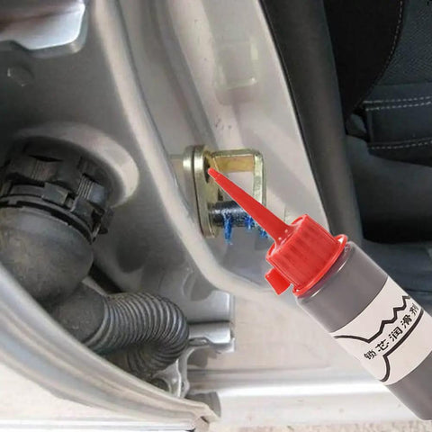 Graphite Garage Door And Lock Lubricant 60ml Oil Free Powder Formula shown being applied to car lock hinge