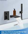Wall Mount Tub Faucet With Waterfall Spout And Handheld Shower, Dope Matte Black Finish, installed on a modern bathtub