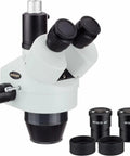 Trinocular Stereo Microscope Head With 3.5X to 45X Zoom, 65mm Field Of View, 8 Inch Working Distance, High Eyepoint 10X Eyepieces With Foldable Eye Guards, Crystal Clear Erect Images, And A Port For Optional Camera Attachment. White trinocular stereo microscope head with 10X eyepieces and camera port
