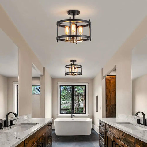 Farmhouse 3 Light Semi Flush Mount Ceiling Light Fixture in Matte Black and Gold Finish with Openwork Circle Frame in a bathroom.
