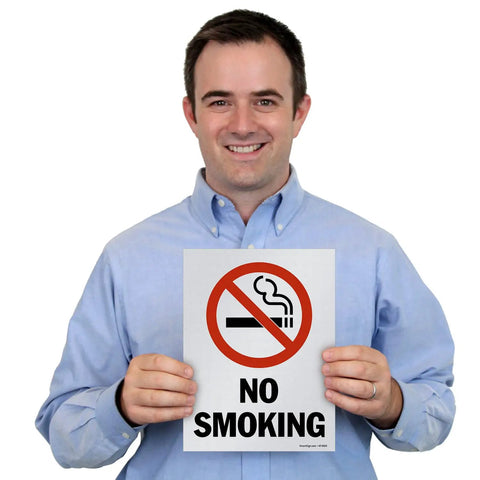 Man holding a No Smoking sign, Pack Of Five Beefy 12 X 9 Inch No Smoking Signs Bold Warning Icon Screen Printed On Sturdy 10 Mil Polystyrene Plastic Indoor Or Outdoor Ready Weather Tough Zero Fuss Quick Staple Install Everyday Reliable Made In Usa.
