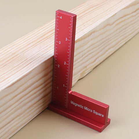 Red Magnetic Machinist Square With Dual Rare Earth Magnets For Hands Free Precision in use on wooden plank