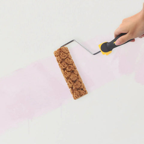 Textured Sponge Paint Roller To Give Your Walls A Badass Pineapple Pattern Finish With Heavy Duty Foam Applicator in use painting a wall.